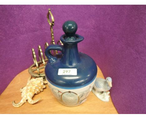 A miscellaneous selection including a Lamb's Navy Rum ceramic decanter, plated toast rack etc
