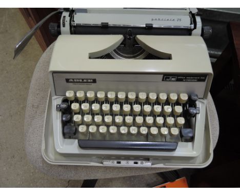A Vintage Adler typewriter in case