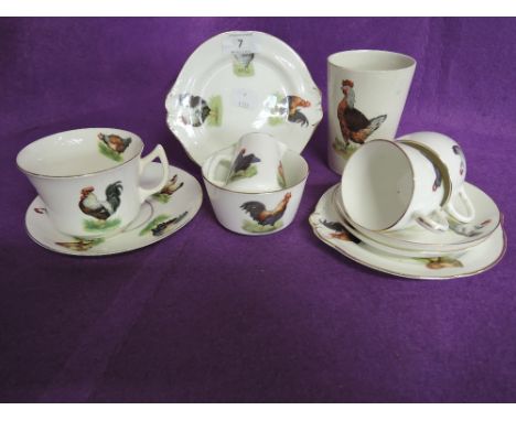A selection of poultry printed ceramics including tea cups and saucers