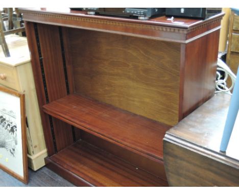 A reproduction mahogany book shelf