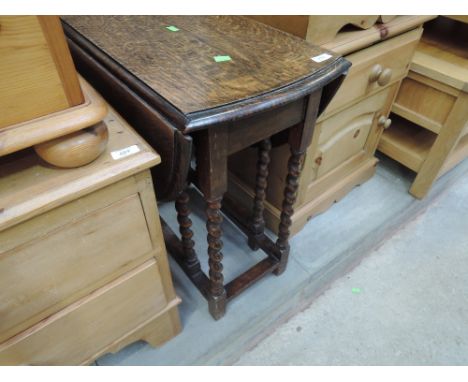 A mid 20th Century oak twist gate leg occasional table