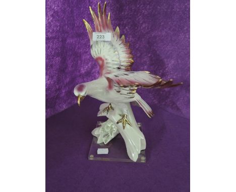 A ceramic bird figure by Sandra 