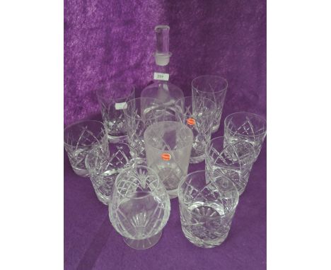 A selection of cut glass whiskey tumblers and decanter