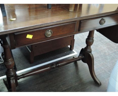 A reproduction Regency style mahogany sofa style table