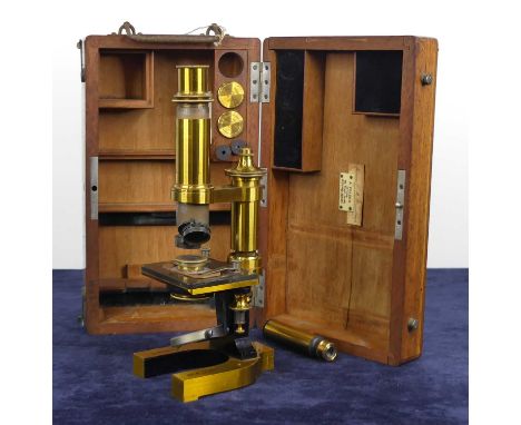 An early 20th century lacquered brass monocular microscope by C. Reichert of Wien, numbered 9275, with spare lenses and acces