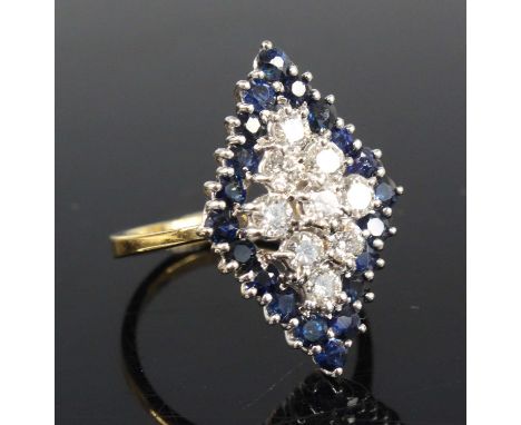 An 18ct yellow and white gold, sapphire and diamond navette shaped cluster ring, comprising a centre section of nine round br