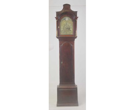 A circa 1800 mahogany longcase clock, having an unsigned 12" arched brass dial, with rolling moon dial to the arch, silvered 