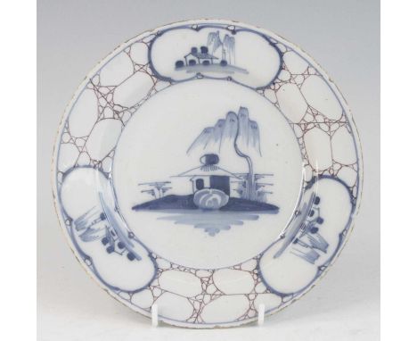A Bristol Delftware plate, Temple Back, circa 1770-75, decorated in blue with Chinese pagodas upon a manganese cracked ice gr