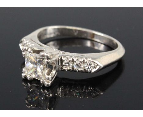 A contemporary platinum diamond solitaire ring the four claw set princess cut diamond weighing approx 1ct, clarity assessed a