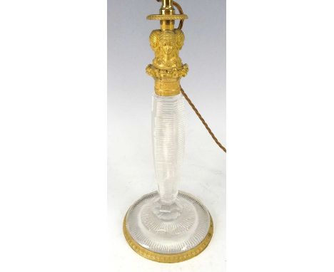 A circa 1900 French gilt bronze and etched cut glass table lamp, the top cast as triform maiden bust group, over figural inse