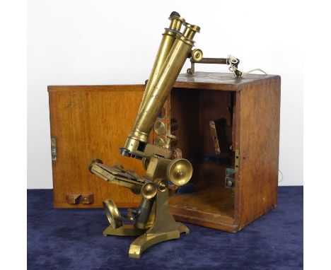 A Victorian lacquered brass compound binocular microscope by C. Collins of London, together with two eyepieces and two lenses
