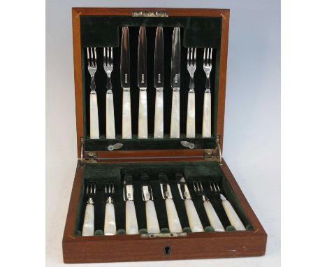 A cased George V silver bladed and mother of pearl handled eight-place setting of fruit knives and forks, maker John Sanderso