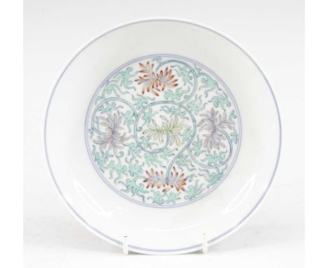 A Chinese porcelain dish, enamel decorated with lotus flowers, apocryphal six character Yongzheng reign mark within two rings