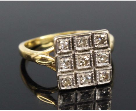 An 18ct yellow and white gold diamond rectangular cluster ring, comprising nine single cut diamonds in grain settings within 