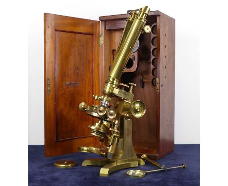 A mid-Victorian lacquered brass binocular microscope by Charles Collins Opticians of Great Portland Street, London, sold with