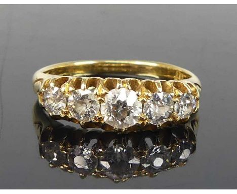 A yellow metal diamond half eternity ring, featuring five graduated Old European cut diamonds in scalloped claw settings, dia