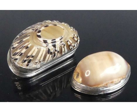 A white metal carved cowrie shell mounted snuff box, the flush hinged cover engraved with a woodland scene, having line carve