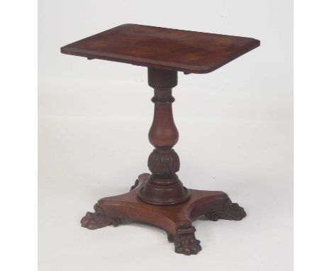 An early Victorian oak pedestal occasional table, the rectangular tilt-top having a moulded edge and rounded corners, to a ri