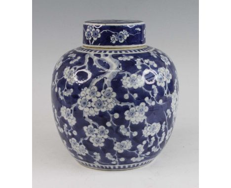 A Chinese blue and white porcelain ginger jar and cover, 19th century, of globular form, decorated with prunus blossom, doubl