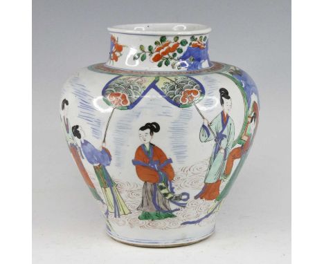 A Chinese wucai vase, of baluster form, enamel decorated with figures within a fenced garden, h.26cmSlight rubbing to the ena