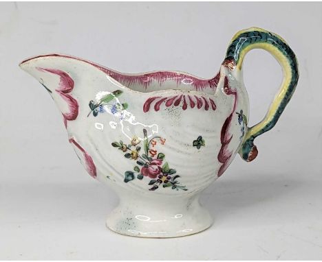 A Philip Christian &amp; Co of Liverpool porcelain cream boat, circa 1775, of shell form, having a lamprey handle, enamel dec