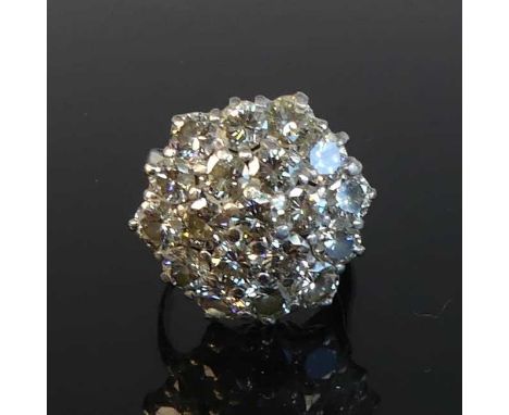 An 18ct white gold diamond circular cluster ring featuring 19 round brilliant cut diamonds in tiered claw settings.  Diamond 