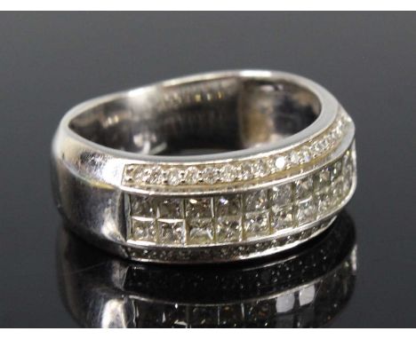 A white metal diamond four-row half hoop eternity ring, featuring two rows each with eleven Princess cut diamonds in calibre 