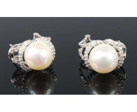 A pair of 9ct white gold, cultured pearl and diamond earrings, each with a 10.35mm cultured pearl within a surround of 38 mel