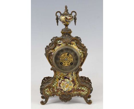 A late 19th century French gilt brass and champleve enamel fronted balloon shaped mantel clock, the whole surmounted with a p