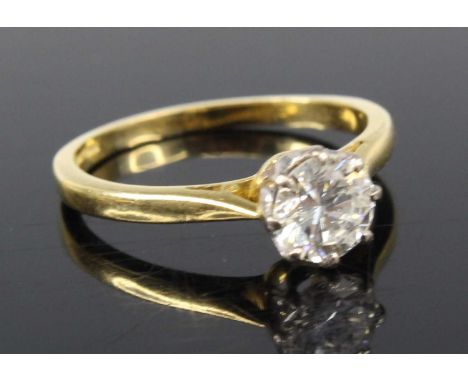 An 18ct gold diamond solitaire ring, the eight-claw set round brilliant weighing 1.00 carat and measuring 6.5 x 3.9mm, colour