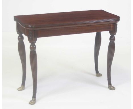 A George III Irish mahogany card table, the D-shaped fold-over top having a reeded edge and on double gateleg rear action, op