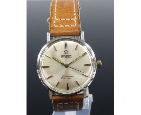 A gent's steel cased Omega Seamaster DeVille automatic wristwatch, ref. 165.020, having signed silvered dial with luminous ha