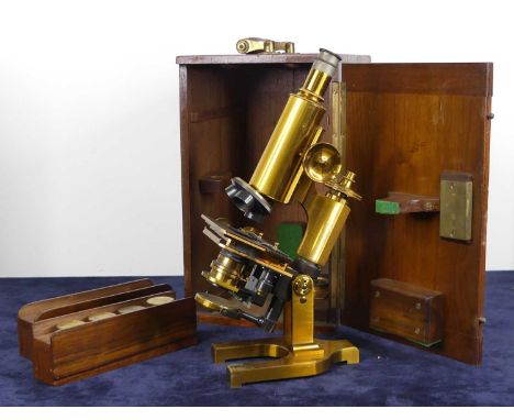 A late Victorian lacquered brass monocular microscope by Henry Crouch of London, numbered 10102, sold with a good selection o