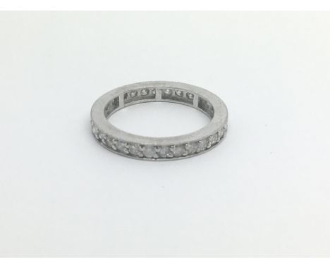 An 18carat white gold eternity ring set with a row of brilliant cut diamonds ring size L-M