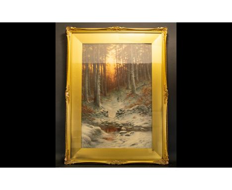 A Late 19th/Early 20th Century Framed Print Large print depicting a winter woodland scene with soft, dusk light filtering thr