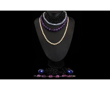 A Mixed Collection Of Costume Jewellery A varied lot to include purple quartz beaded necklace, opalescent bicone bead collar 