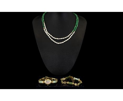 A 9ct Gold And Jadeite Bracelet Together with a yellow metal oriental style ladies wristwatch with faux mother of pearl dial 