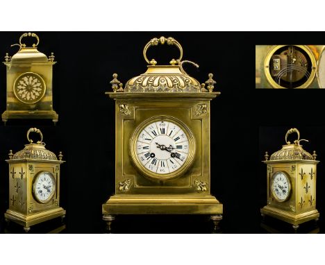 A Late 19th Century French Striking Mantle Clock Comprising ceramic chapter dial with Roman and Arabic numerals. Brass case w