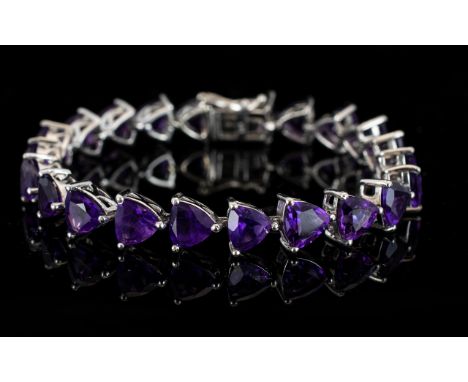 Amethyst Trillion Cut Tennis Bracelet, 22cts of rich, deep purple amethyst in the unusual trillion cut, set in a single row i