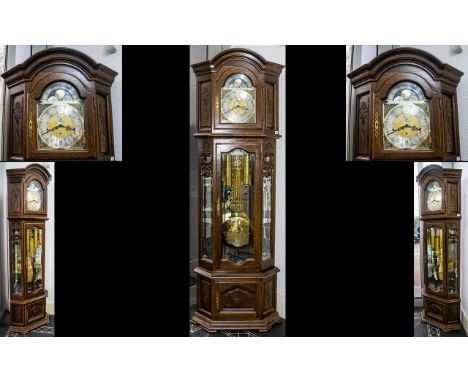 A Modern Triple Weighted Oak Howard Longcase Clock with a silver chapter dial, Roman Numerals, Spangles and Moon phase. Playi