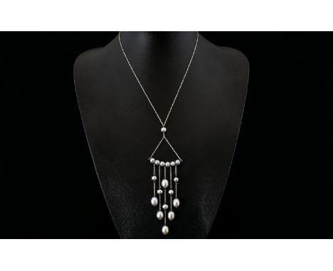 A Limited Edition Cultured Pearl And Sterling Silver Contemporary  Festoon Necklace Of triangular graduated form with five gr