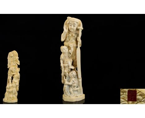 Japanese - Signed Meiji Period Tokyo School Finely Carved Ivory Okimono Figure Group - Fisherman with Two Children, One Holdi