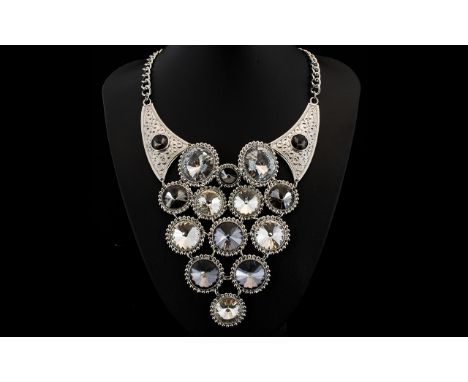 White and Grey Large Circular Crystal Statement Necklace, a dramatic, long V shaped necklace formed from linked circular, con