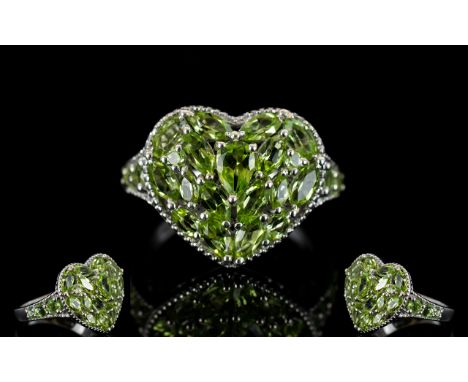 Peridot Heart Shape Cluster Ring, a pear cut peridot set slightly above a cluster of marquise and round cut, closely set, per