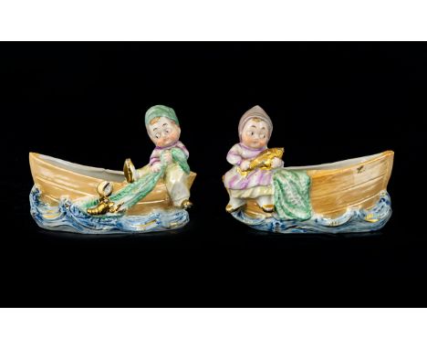 A Pair Of German Googly Eyed Ceramic Spill Vases Early 20th century continental vases in gilt and lustre glaze, each in the f