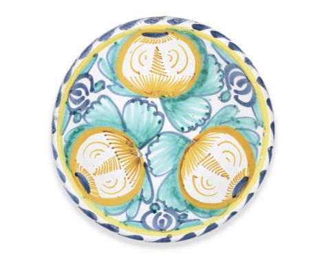 A good English Delftware pomegranate charger, circa 1670-90London or possibly Brislington, boldly painted with three orange s