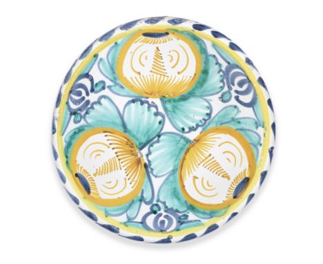 A good English Delftware pomegranate charger, circa 1670-90London or possibly Brislington, boldly painted with three orange s