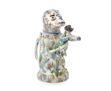 A rare Staffordshire pearlware bear jug and cover, circa 1790The seated animal wearing a blue collar, its long tail curling o