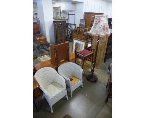 A beech standard lamp, two painted wicker chairs, a piano stool and a coffee table 