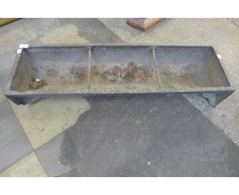 A galvanised feeding trough 
